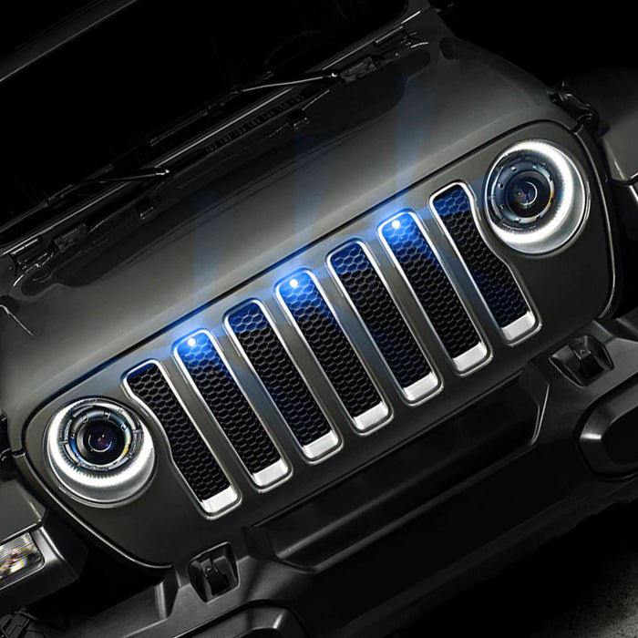 Front end of a Jeep Wrangler JL with cyan Pre-Runner Style LED Grill Light Kit installed.