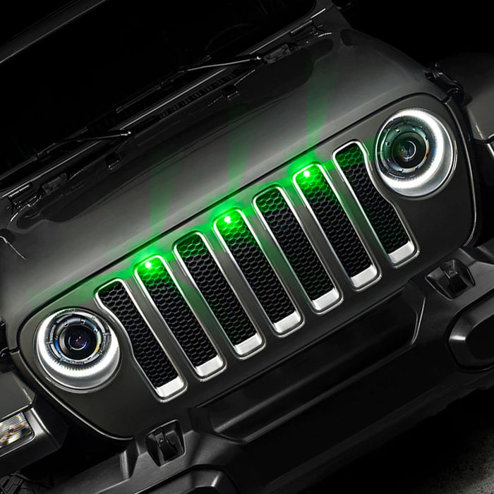 Front end of a Jeep Wrangler JL with green Pre-Runner Style LED Grill Light Kit installed.