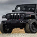 Three quarters view of a black Jeep Gladiator JT with white Pre-Runner Style LED Grill Light Kit installed.
