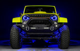 Front view of a yellow Jeep with 7" Oculus Headlights installed, set to blue LEDs.