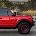 Side view of a red Ford Bronco with Integrated Windshield Roof LED Light Bar System installed.