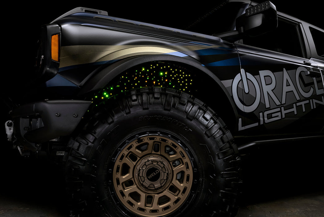 Low shot of fiber optic wheel liner kit installed with yellow LED lighting.