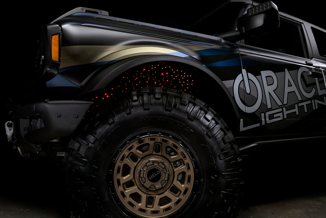 Low shot of fiber optic wheel liner kit installed with red LED lighting.