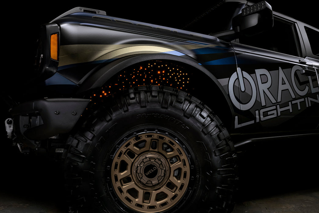 Low shot of fiber optic wheel liner kit installed with amber LED lighting.