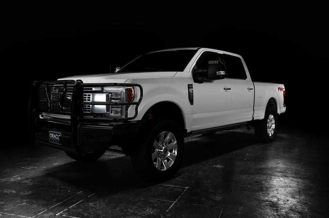 Three quarters view of a white Ford SuperDuty with LED Off-Road Side Mirrors installed.