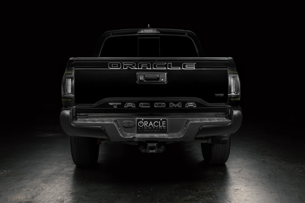 Straight rear view of black Toyota Tacoma with Tinted Flush Style LED Tail Lights installed