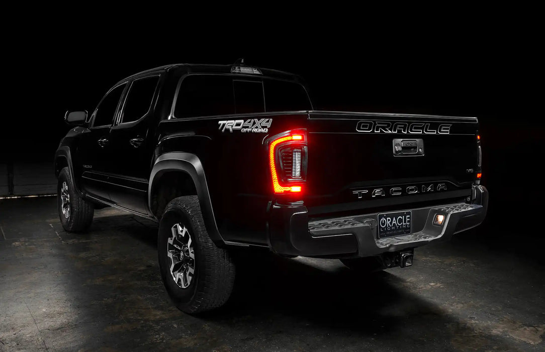 Rear view of black Toyota Tacoma with Flush Style LED Tail Lights installed and brake lights on