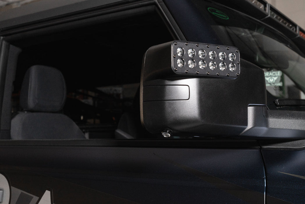 Close-up of a LED Side Mirror installed on a Ford Bronco with Puddle Light upgrade
