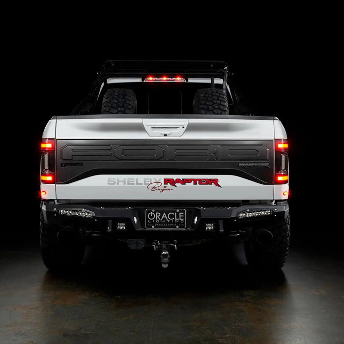 Rear view of white Ford Raptor with Flush Style LED Tail Lights installed and running lights turned on