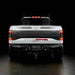 Rear view of white Ford Raptor with Flush Style LED Tail Lights installed and running lights turned on