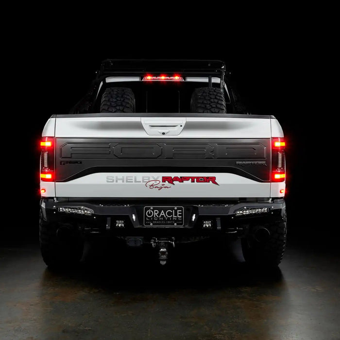 Rear view of a white Ford Raptor with Flush Style LED Tail Lights installed and brake lights on