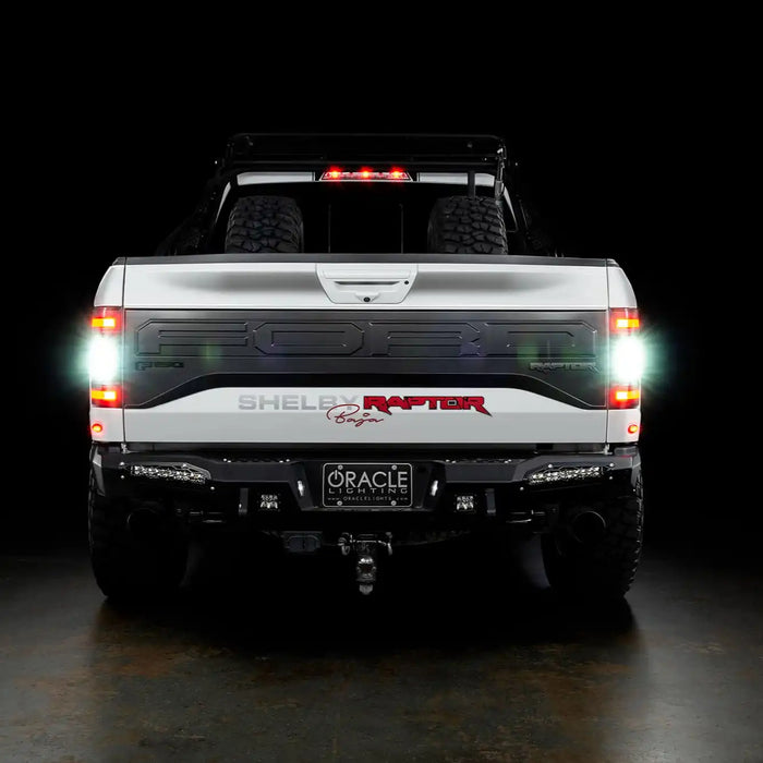 Rear view of white Ford Raptor with Flush Style LED Tail Lights installed and reverse lights turned on