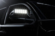 Close up of glowing LED Off-Road Side Mirror Ditch Lights installed on Toyota Tacoma