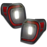 Angled view of Flush Style (Lensless) LED Tail Lights for 2014-2023 Toyota 4Runner with reverse lights on