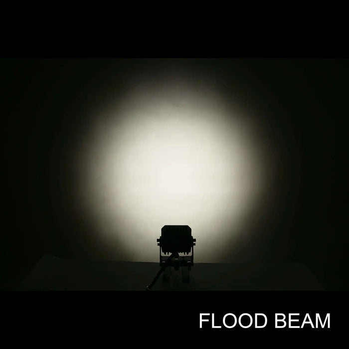 Floodlight casting a strong beam of light in a dark setting with 'FLOOD BEAM' text.
