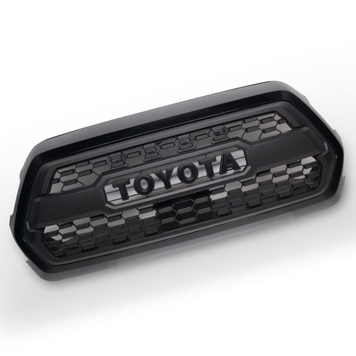 Black Toyota grille on a white background