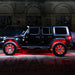 Side view of black Jeep with red LED wheel rings.