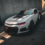 Three quarters view of a Chevrolet Camaro with red headlight DRLs.