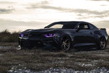 Three quarters view of a Chevrolet Camaro with purple headlight DRLs.