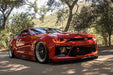 Red camaro rolling with red halos and DRL
