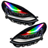 Tesla Model 3 headlights with rainbow DRLs.