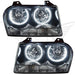 Chrysler 300 headlights with white LED halo rings.