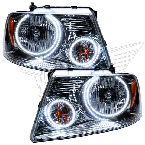 Ford F-150 headlights with white LED halo rings.