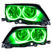 BMW 3 Series headlights with green LED halo rings.