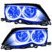 BMW 3 Series headlights with blue LED halo rings.