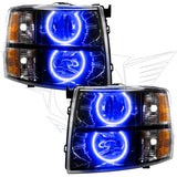 Chevrolet Silverado headlights with black housing and blue LED halo rings.