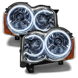 Jeep Grand Cherokee headlights with white LED halo rings.