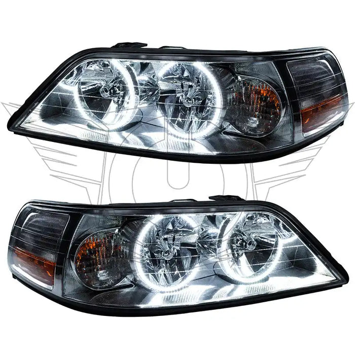 Lincoln Town Car headlights with white LED halo rings.