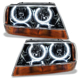 Jeep Grand Cherokee headlights with white LED halos.