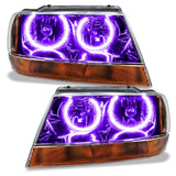 Jeep Grand Cherokee headlights with purple LED halo rings.