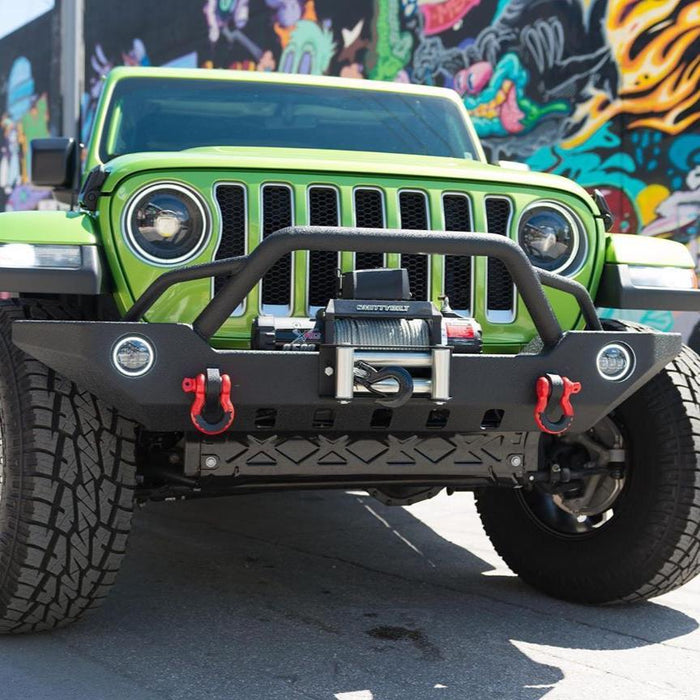 Front end of a green Jeep Wrangler with Oculus Headlights installed.