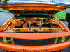 Orange Challenger with yellow engine bay lighting.