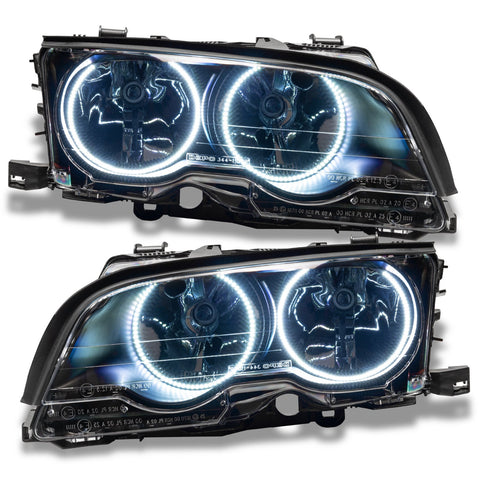 BMW 3 Series headlights with white LED halo rings.