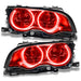 BMW 3 Series headlights with red LED halo rings.