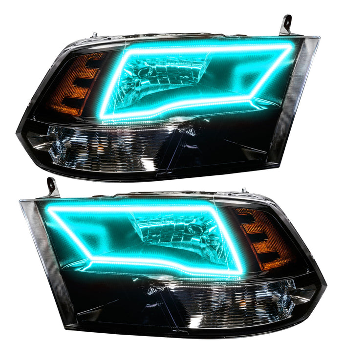 2009-2018 RAM ColorSHIFT Switchback Quad Pre-Assembled Halo Headlights - Black Housing with cyan halos.