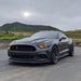 Three quarters view of a Ford Mustang with amber headlight halos and DRLs.