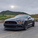Three quarters view of a Ford Mustang with amber headlight halos and DRLs.
