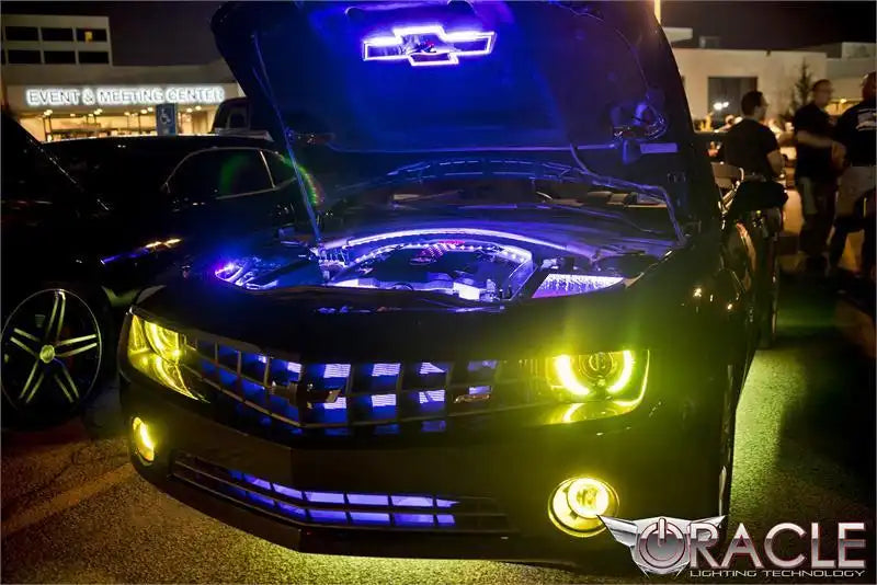 Camaro with yellow and blue LED lighting.