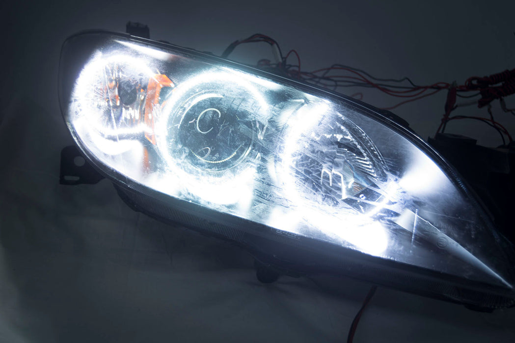 2004-2009 Mazda 3 4 Door Projector Headlights - ORACLE WHITE LED Halos