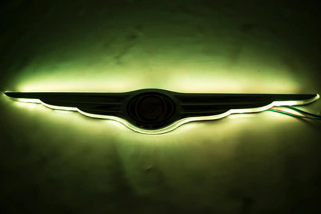 Gen I Chrysler Illuminated LED Rear Wing Emblem with yellow LEDs.