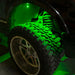 Close-up of wheel well with green rock light glowing.