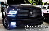 Front end of a Dodge Ram with white LED headlight and fog light halo rings installed.