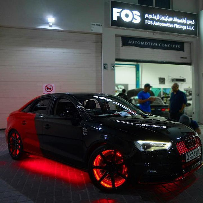 Black Audi with red LED illuminated wheel rings.