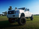 Three quarters view of a Ford Super Duty with white LED headlight halo rings installed.