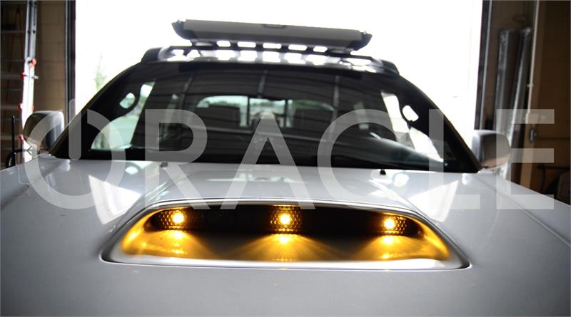 Close-up of grill vent with yellow billet lights