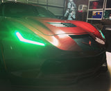 Front end of a Chevrolet C7 Corvette with green headlight DRLs.